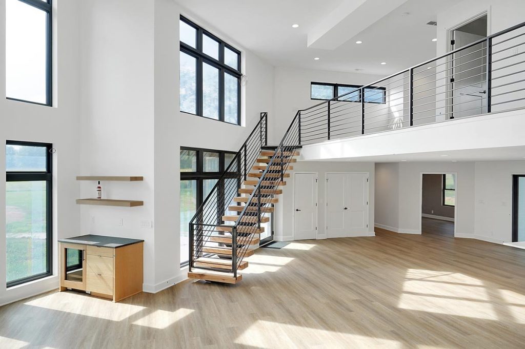 Open staircase with steel railings and baby gate