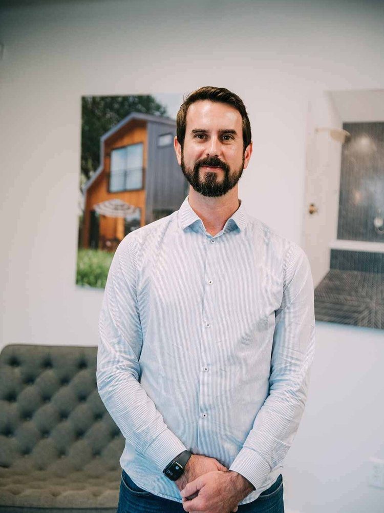 Chris Eldridge, Louisville Signature Home Director of Design and Construction, in a modern office setting.