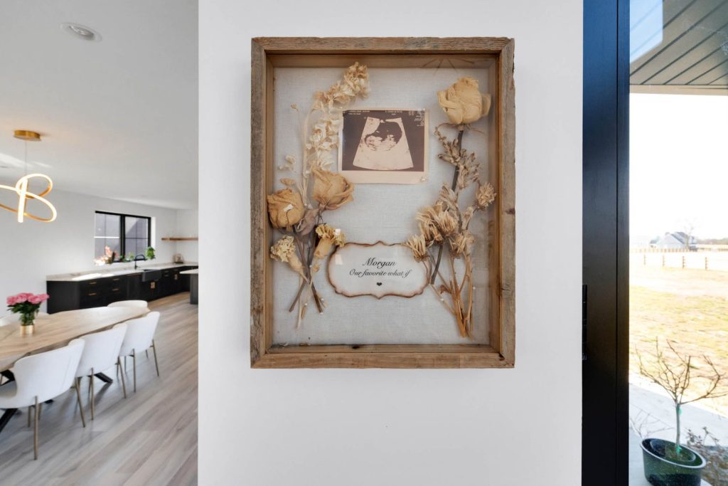 Louisville modern living space with shadow box, dried flowers, and keepsake by top custom home builders.