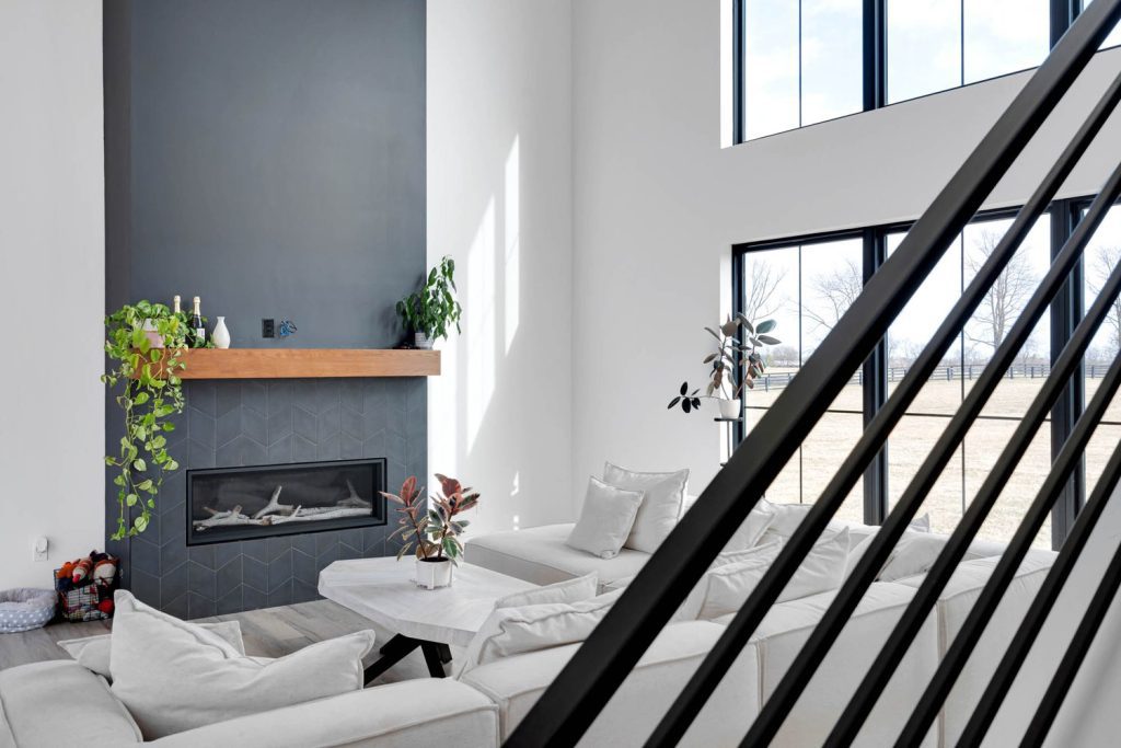 Bright Louisville Modern Living Room with Gray Fireplace and Minimalist Design by Leading Home Builders
