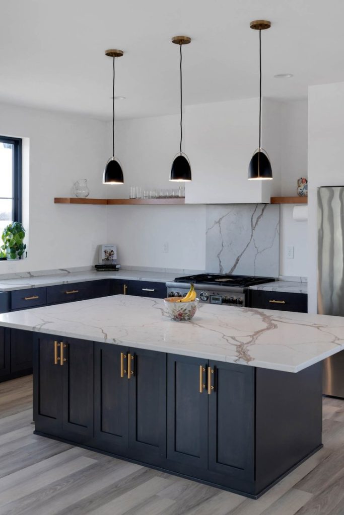 Louisville modern kitchen with dark cabinets, marble island, black pendant lights, and sleek minimalist design.