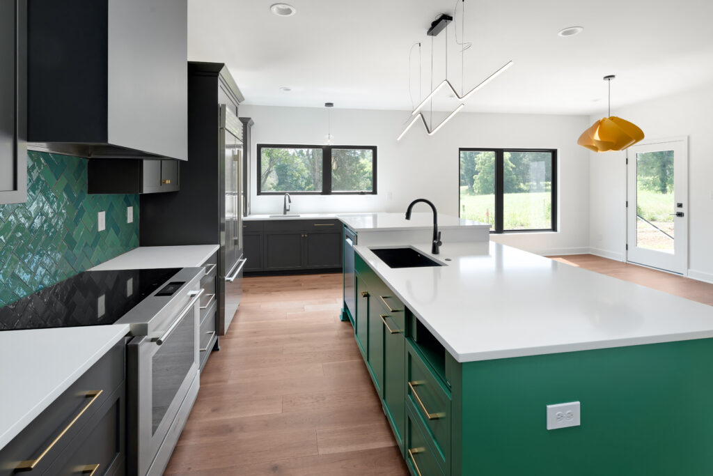 Modern Louisville kitchen with green cabinets, white countertops, and teal tile backsplash.