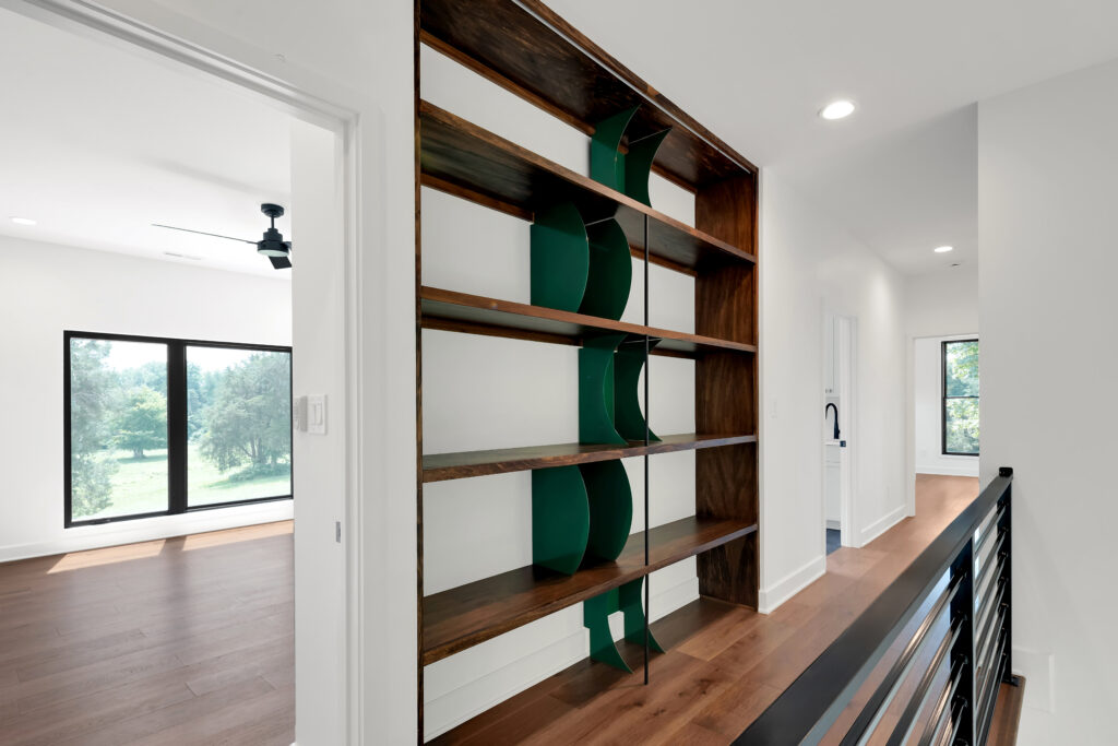 Modern Louisville interior hallway featuring wood floors and open green divider shelves.