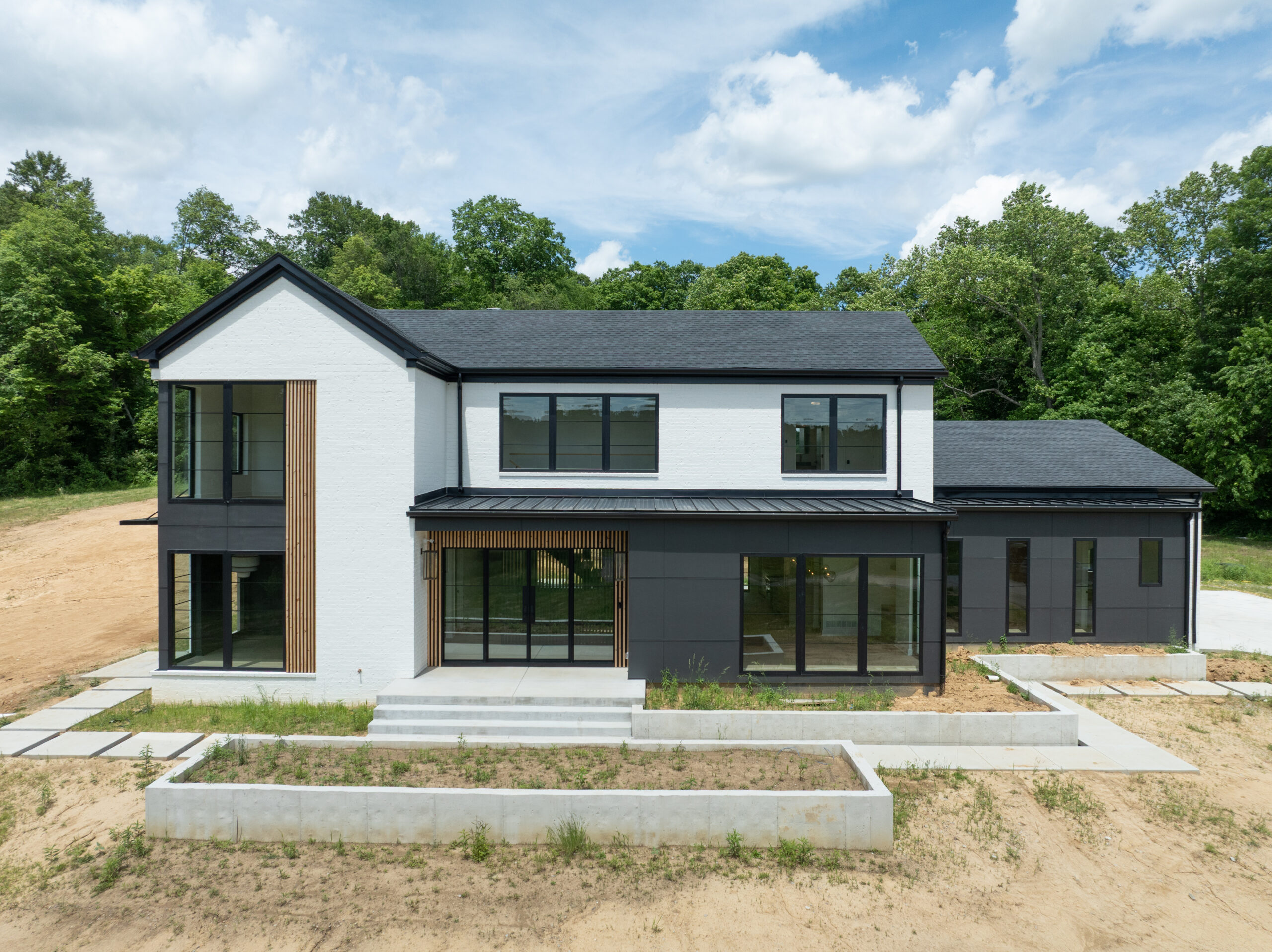 Contemporary Louisville custom home with minimalist black and white design and expansive windows.