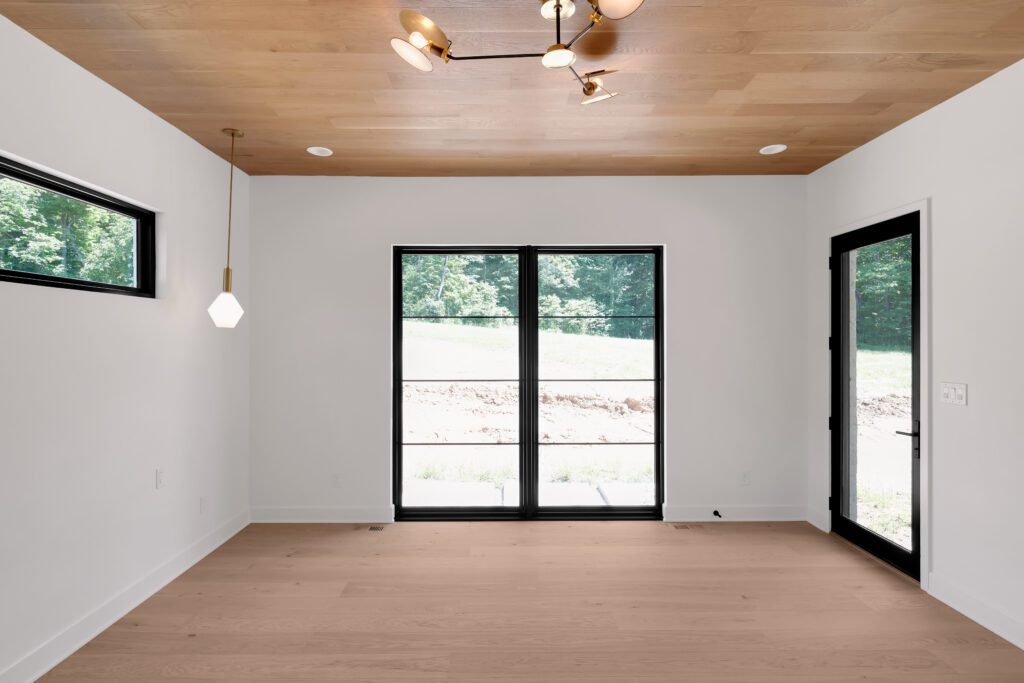 Contemporary Louisville room with hexagonal pendant, light wood accents, and serene feel.
