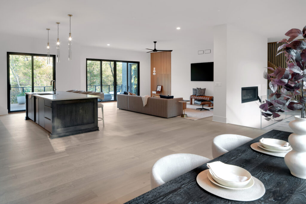Spacious living and dining area in Woodbridge Place, Prospect KY by top custom home builders at Homearama 2025 with airy ambiance and natural light.