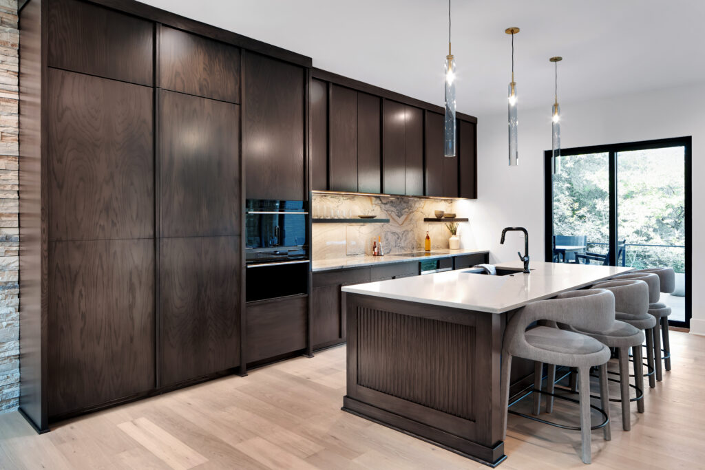Stylish Louisville kitchen with dark cabinets and large island built by top custom home builders.
