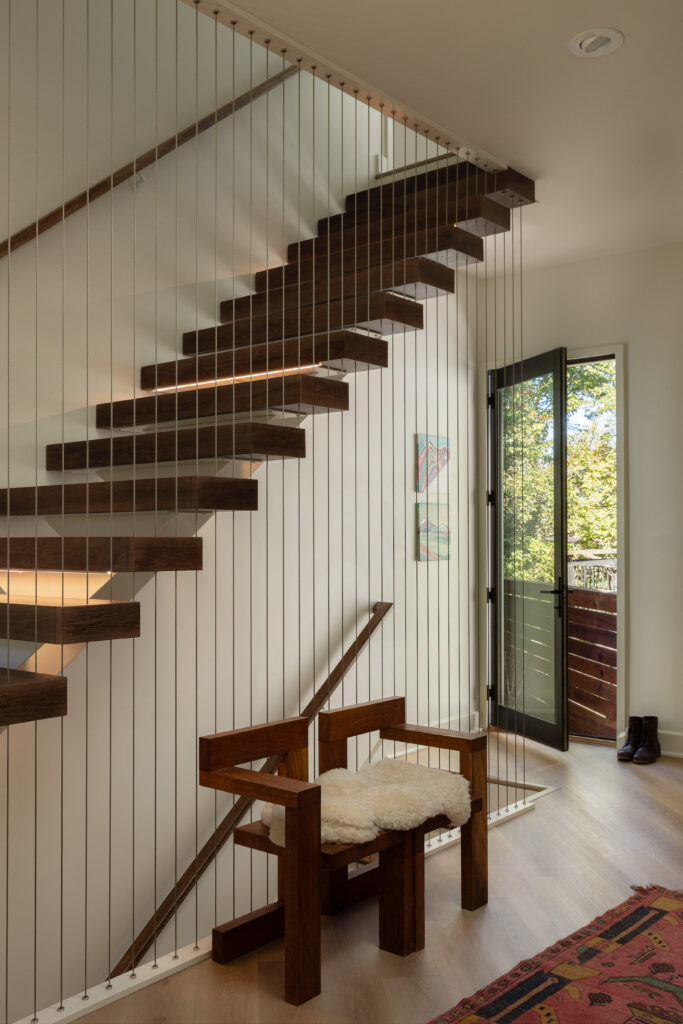 Floating staircase design in custom home in Louisville.