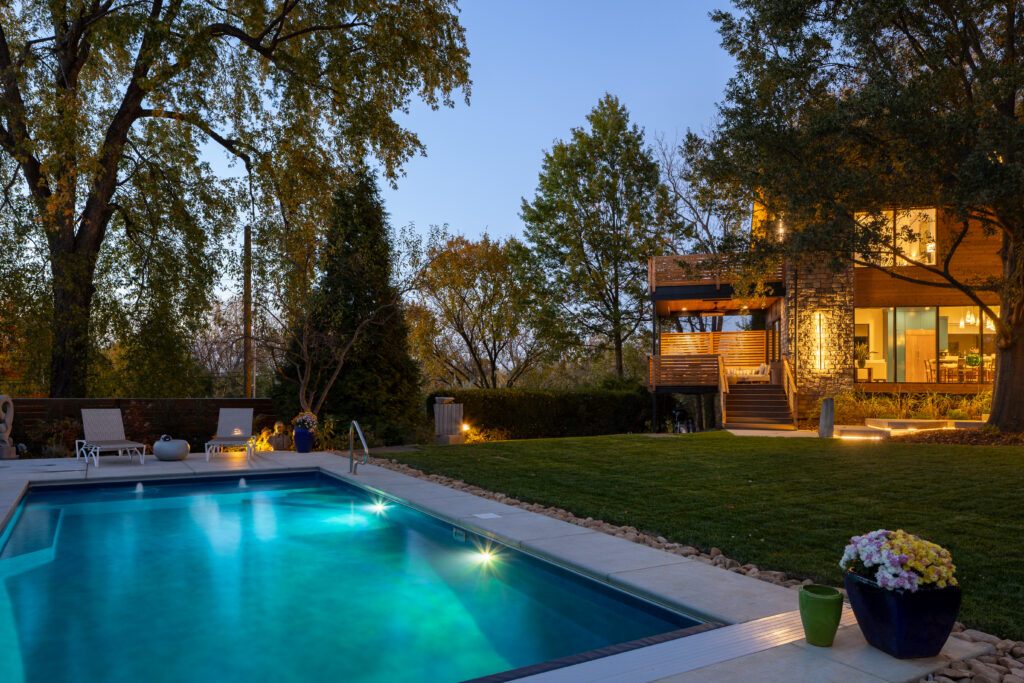 Custom in ground pool in Louisville Highlands with stunning 2 floor patio.