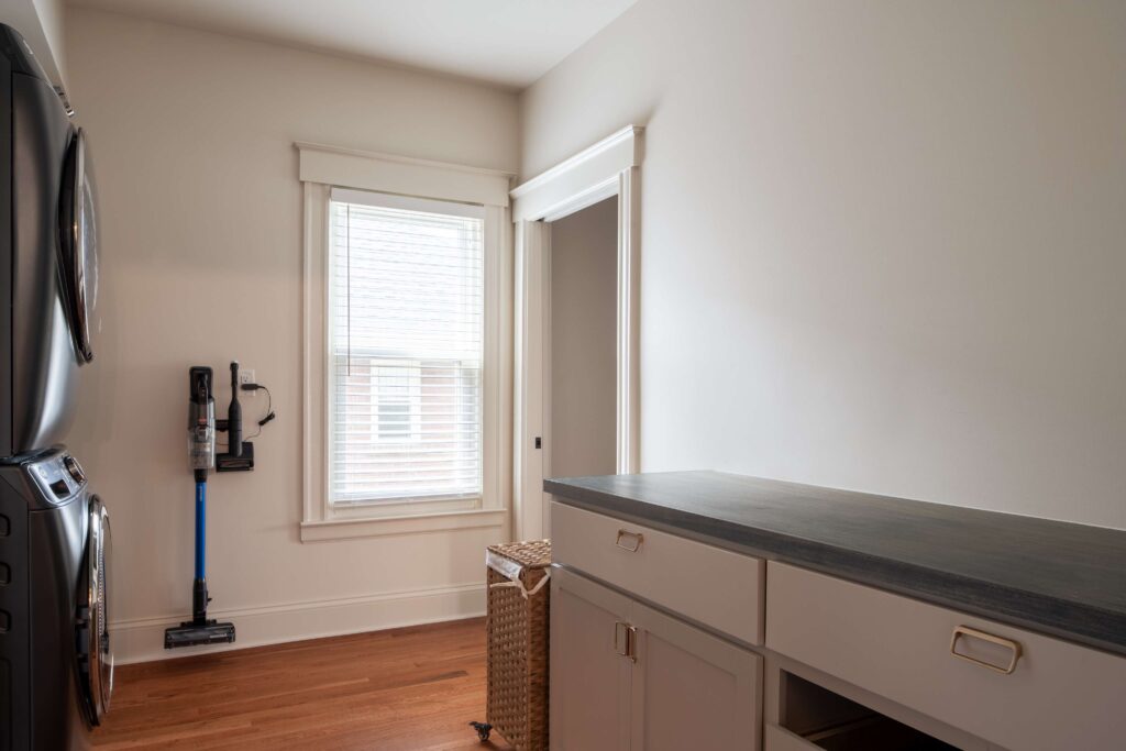 Renovated laundry room connected to primary suite